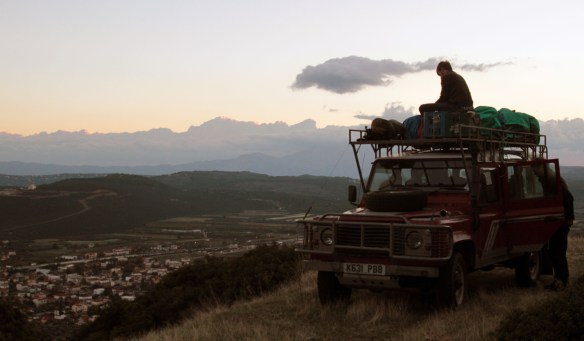 Sunrise: stowing our bags on the roof in preperation for a long drive